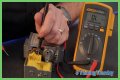 How do you test a Honeywell gas valve with a multimeter?